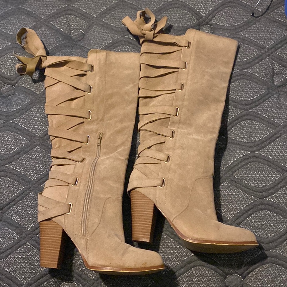 Khaki knee high boots with laces up the back